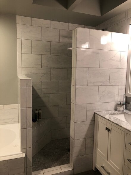 fully remodeled master bathroom with granite and tile and sky light. - 9915 NE 124th St