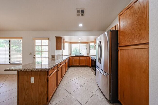 Building Photo - Welcome to this stunning 4-bedroom, 2-bath...