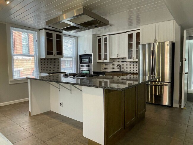 Building Photo - Small pets are welcome with an additional ...