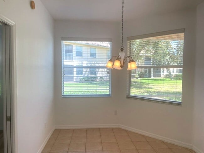 Building Photo - Elegant 3 Bedroom End-Unit Condo with Screened Lanai & Pond Views and A Private Garage