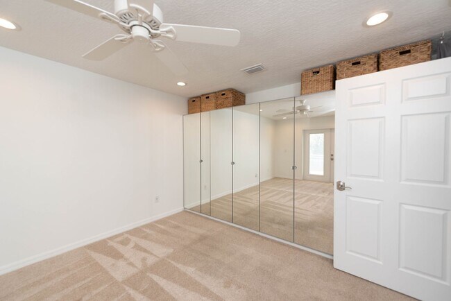 Building Photo - Live the ultimate Space Coast waterfront lifestyle at this stunning beachside canal home in Satel...