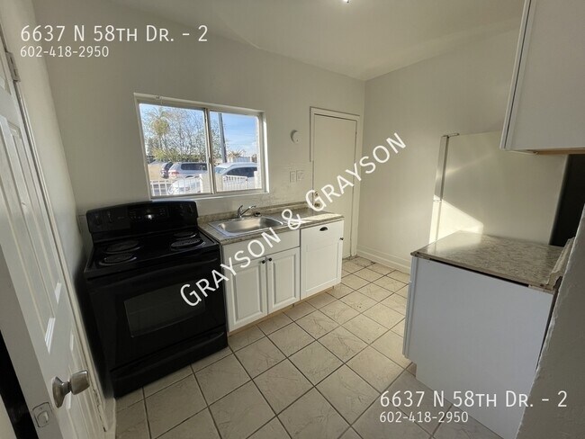 Building Photo - 6637 N 58th Dr