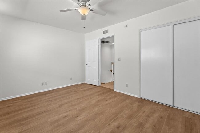 Building Photo - Light Filled Townhome Style Condo with Private Patios and Direct Access