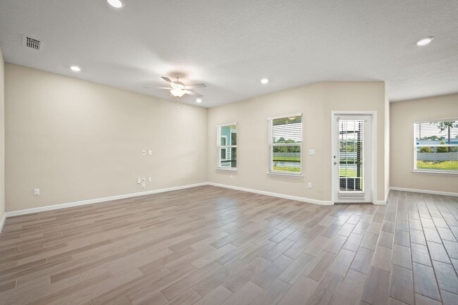 Building Photo - Spacious 4-Bedroom Home with Screened Pati...