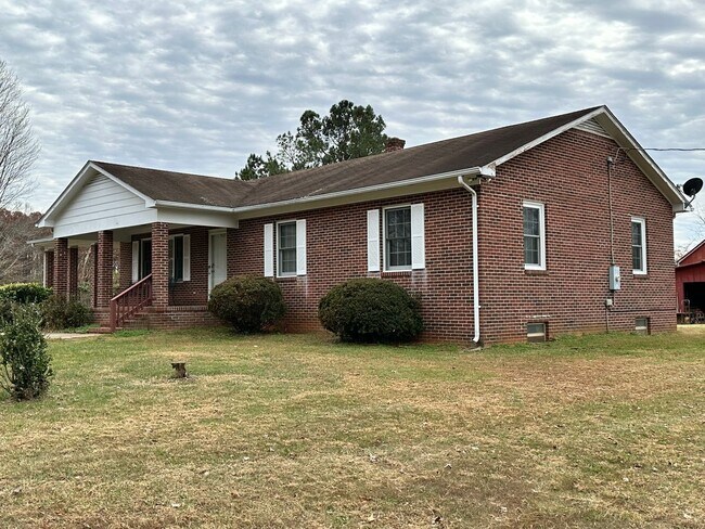Building Photo - 4-Bedroom Brick Home with Full Unfinished ...