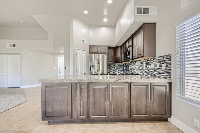 Building Photo - Discover this spacious and well-appointed 2-bedroom + office/den, 2-bath condo located in the hig...