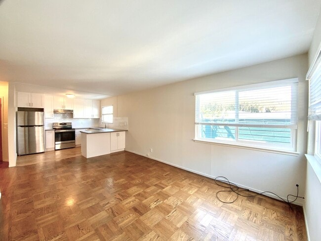 Building Photo - REMODELED KITCHEN! Storage, Parking Available, On-Site Laundry!