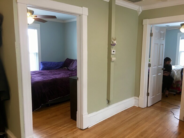 From living room, the middle bedroom doorway on the left and front bedroom doorway to the right. - 1320 Jefferson St NE