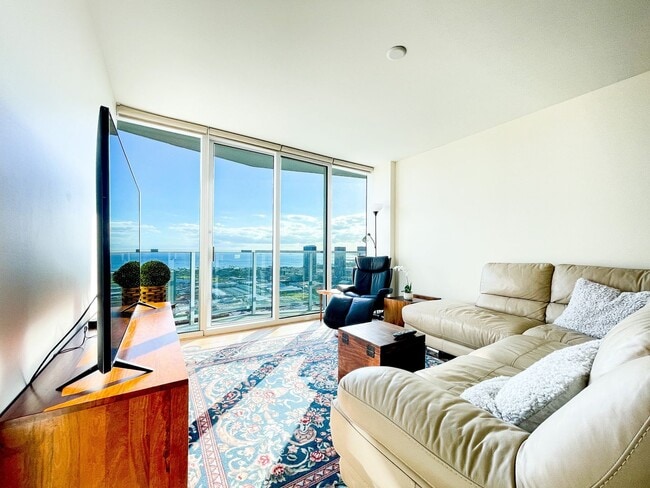 Building Photo - Furnished Symphony Condo with Direct Ocean Views and Two Parking