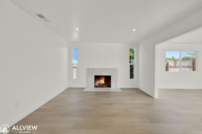 Building Photo - Fully Renovated 4-Bedroom Home with Firepl...