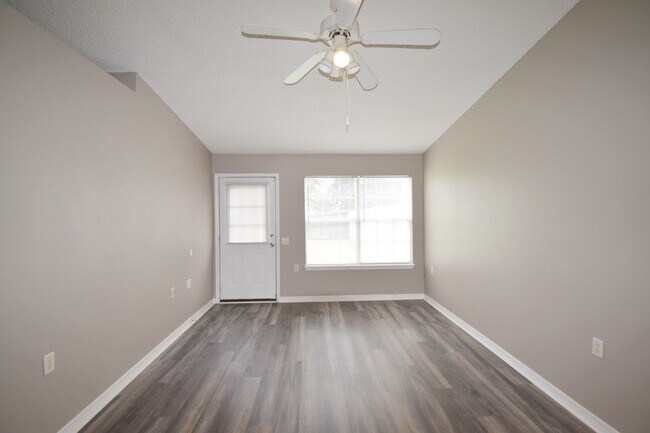Building Photo - 2BR Patio Home with Open Layout, LVP Flooring, Private Fenced Yard, HOA Lawn Care & Convenient Bl...