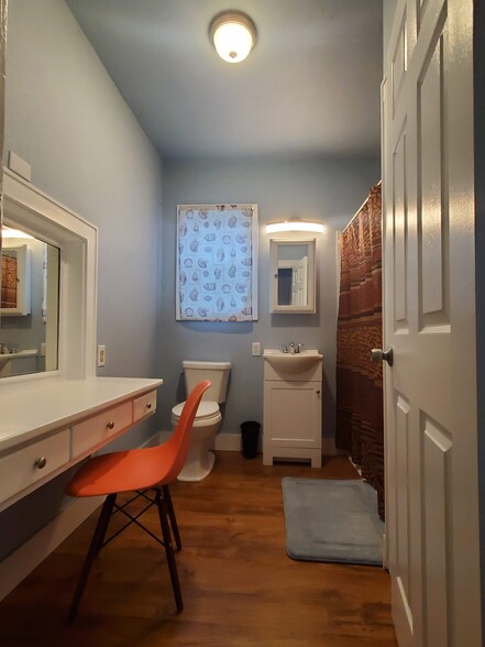 Bathroom with Vanity. More cabinets and drawers behind the door. - 1621 6th St