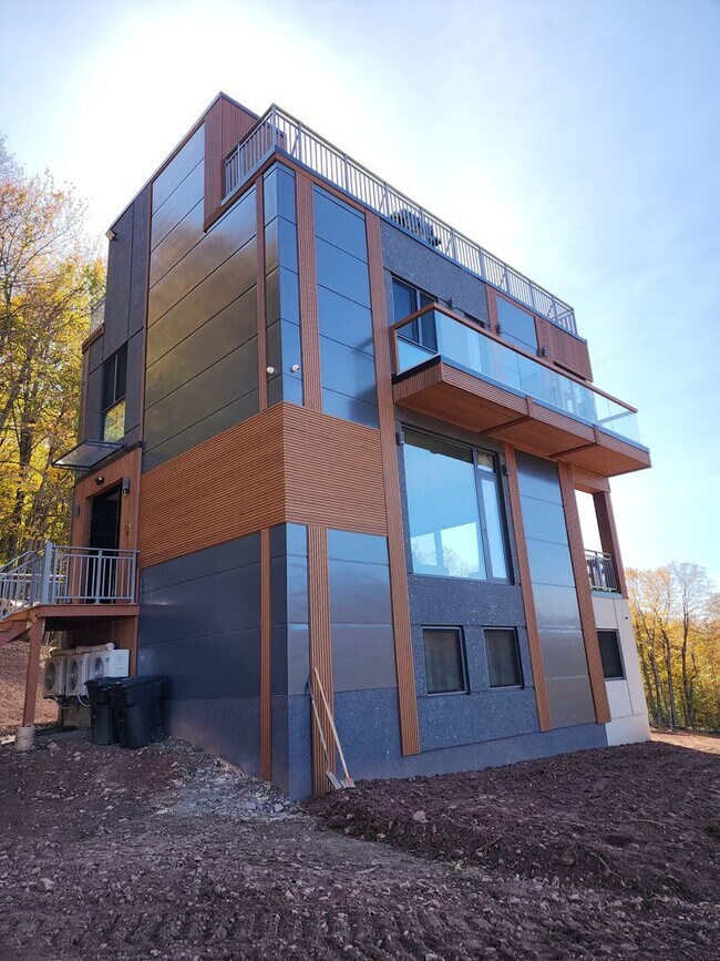 Building Photo - Modern Mountain Retreat with Rooftop Hot T...