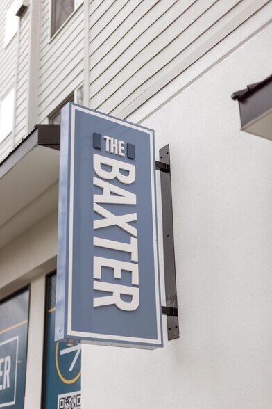 The Baxter street sign marks the entrance on NE 2nd Street in Bellevue. - The Baxter