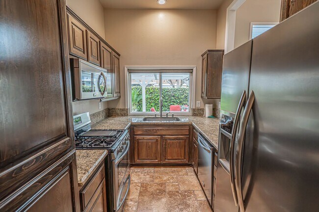 Building Photo - COMING SOON! Charming 2-Bedroom Home with a Versatile Loft in The Bungalows of Valencia!