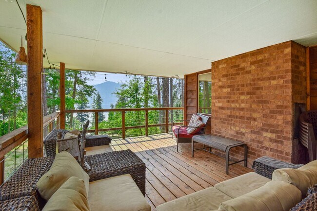 Building Photo - 2700 + sq ft family home has it all! Over 2 acres of land and a stunning view of Lake Pend Oreille