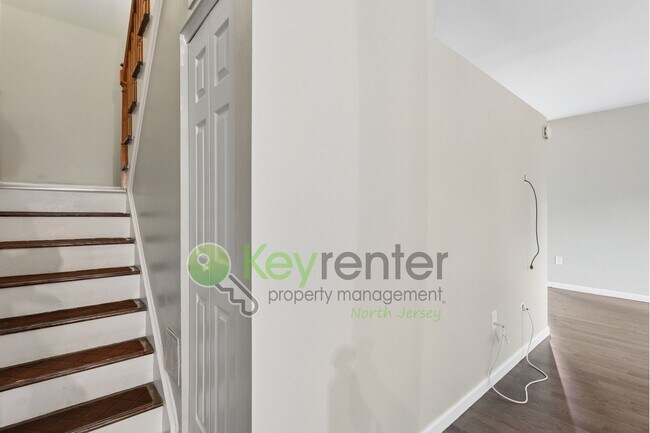 Building Photo - Spacious 2BR/2BA Duplex in Gated Community with Parking, Washer/Dryer & NYC Skyline Views