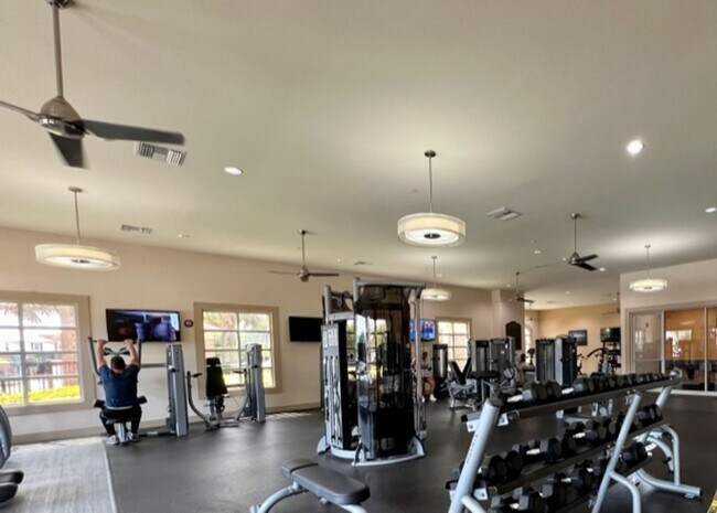 Building Photo - EAGLE CREEK LAKE NONA! WELCOME HOME! Beautiful water views! Spacious 2 story-3 bedroom 2.5 bath h...