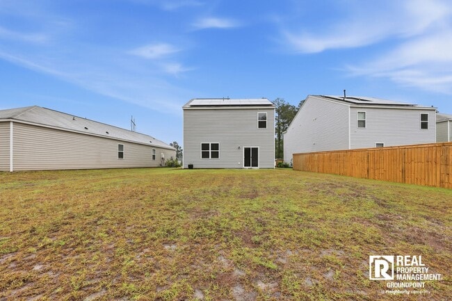 Building Photo - 4 Bedroom Rental in Cane Bay Plantation with Open Layout and Pond View
