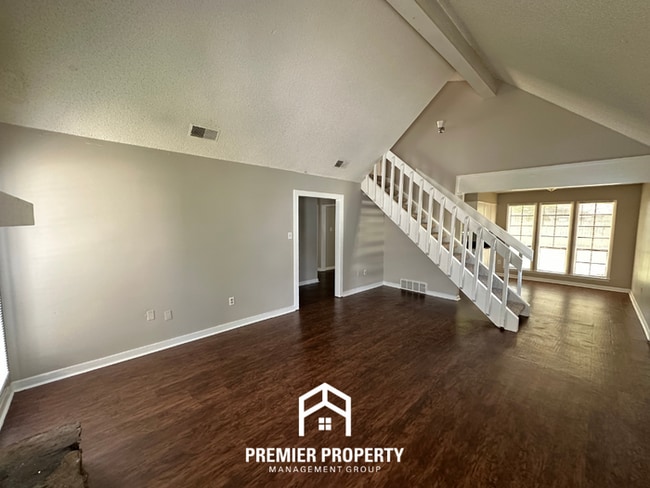 Building Photo - Beautiful 3BR/2BA Near Southwind | Soaring Vaulted Ceilings, Fireplace & Fenced Yard