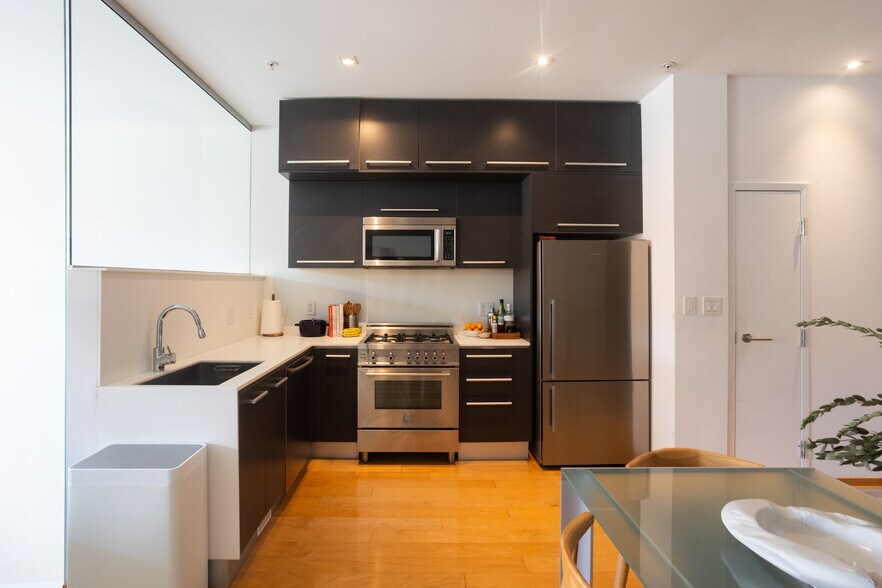 Gourmet kitchen with high-end appliances: Bertazzoni, Miele, Fisher & Paykel), and high-end finishes - 2250 11th St NW