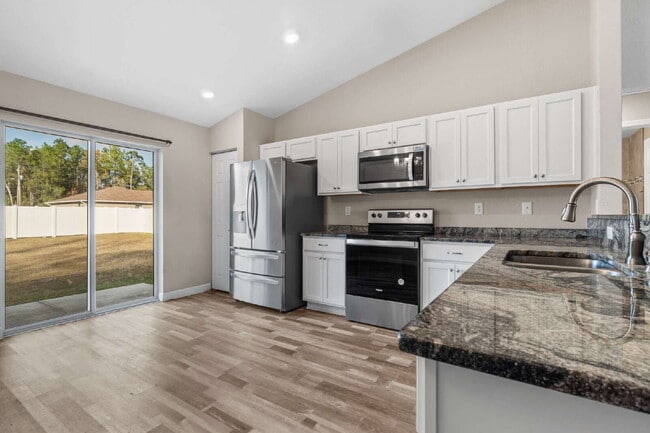 Building Photo - 3BR, 2BA Available Now with Fenced Yard and New Floors, North Marion Oaks