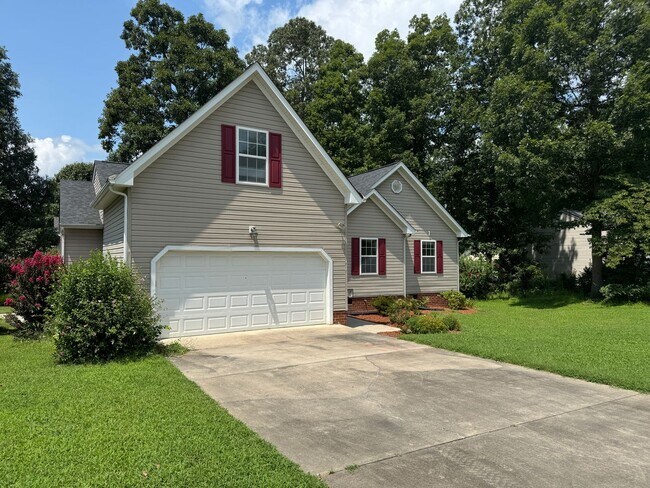 Building Photo - Location! 4 bedroom with garage convenient...