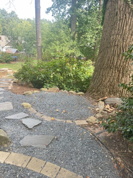 Small outdoor seating area adjacent to apartment entrance - 460 E Pharr Rd