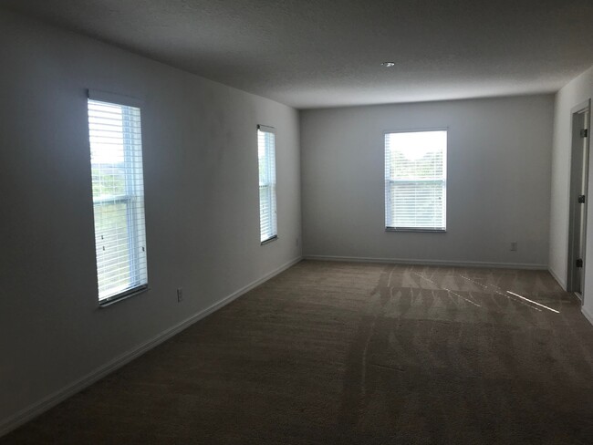 Building Photo - 4 BED HOME IN APOPKA!!! GATED COMMUNITY!!!...