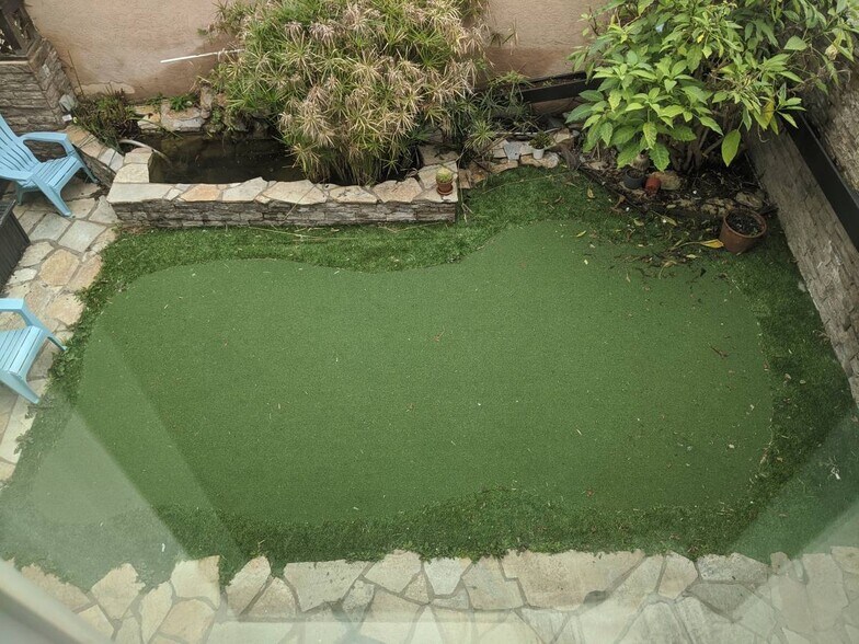Gated yard with turf and pond - 1813 Oliver Ave