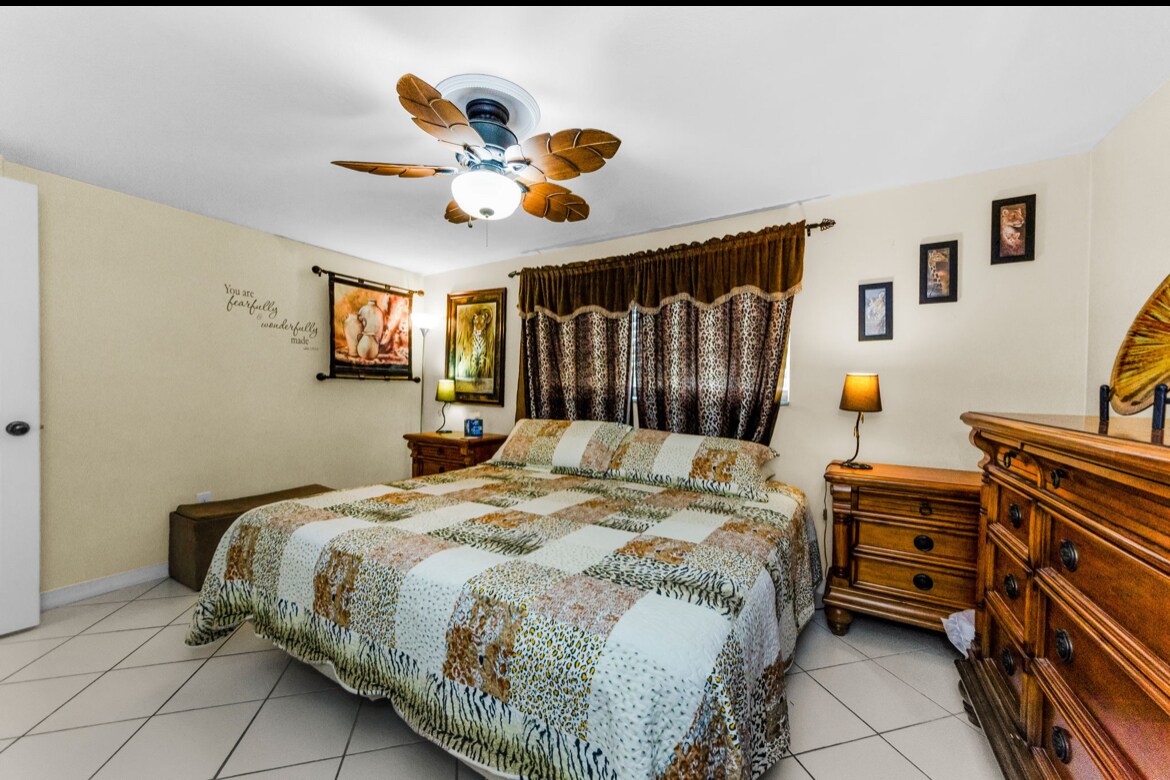 Master bedroom with matching dressers and closet. Mounted TV - 3931 Sail Dr