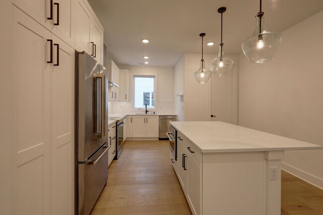 Building Photo - Live Where Style Meets Convenience – 2BR Townhome + Garage