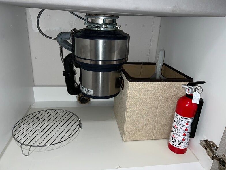Kitchen: Fire extinguisher (under sink) - 1177 Honey Trl