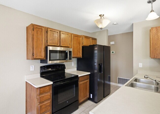 Building Photo - Corner-Lot Garden Home with Fireplace and Private Patio