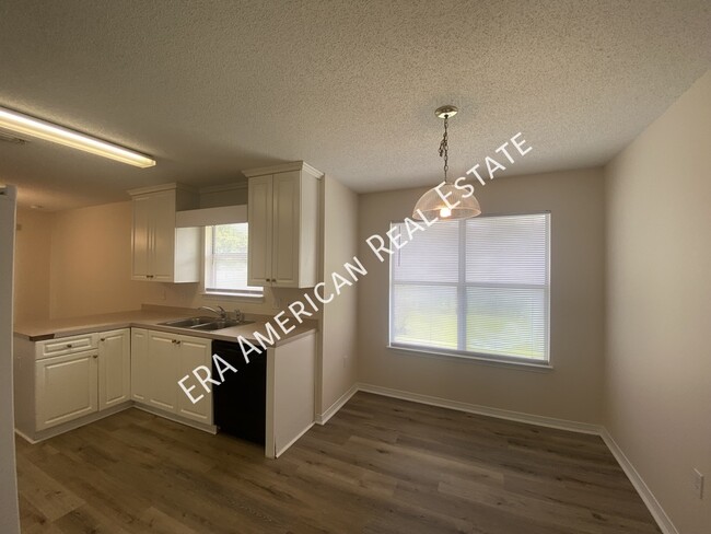 Building Photo - 7468 Woodmont Rd