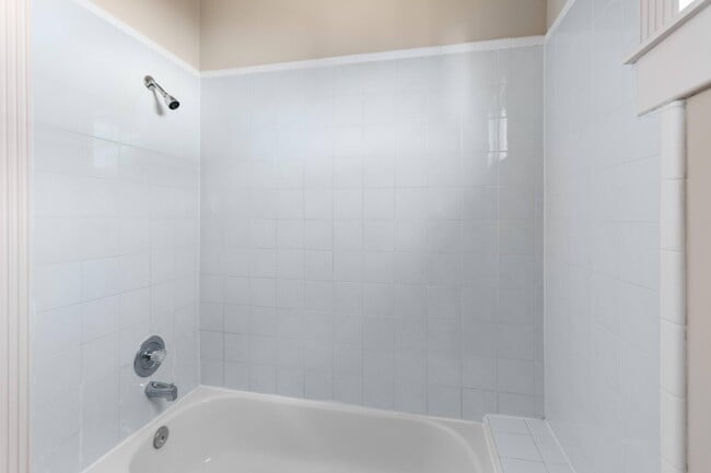 Tiled shower and full-size tub in hallway bathroom - 515 W 17th St