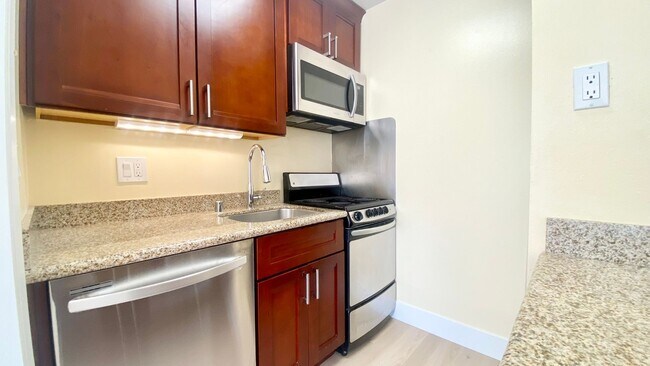 Building Photo - Large & Sunny Deck with this Cozy 1-Bedroom