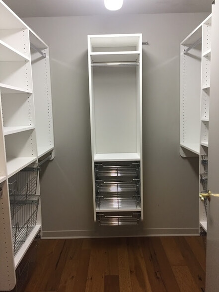 Professional closet organizing systems throughout condo - 360 W Washington Ave