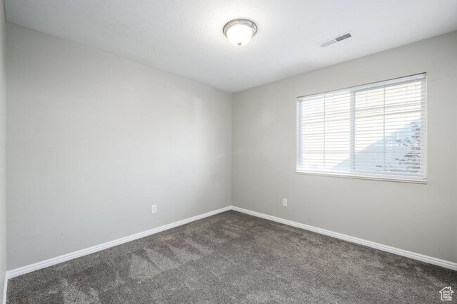 Building Photo - Spacious 3-bedroom top level condo is a mu...