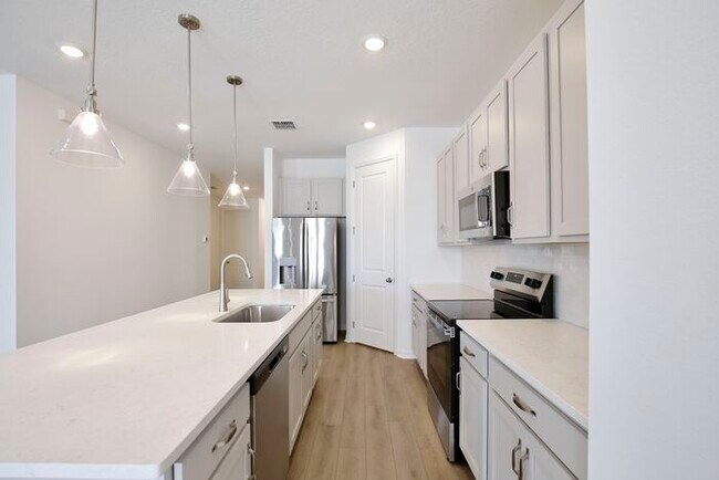 Building Photo - Stylish Sunbrooke Sanctuary! Modern 4/2 Ho...