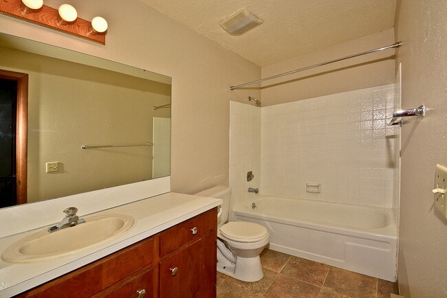 Building Photo - 2 bedroom 1.5 bath with a carport & backyard