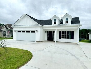 Building Photo - LOOK AT THIS ONE! BEAUTIFUL home with a pond view right outside the back patio!