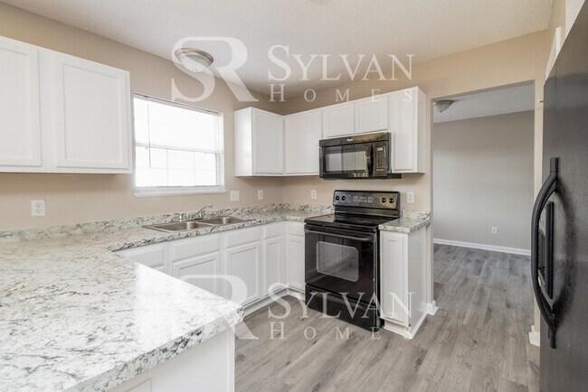 Building Photo - Enjoy living the good life in this 4 bedro...