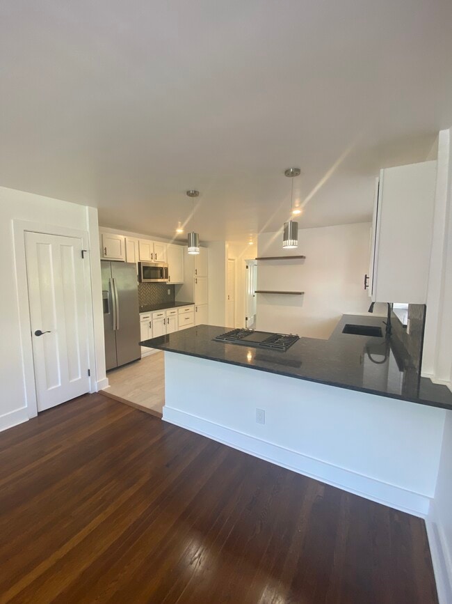 Granite countertops, stainless steel appliances, coffee bar and plenty of cabinetry! - 3041 Cleinview Ave