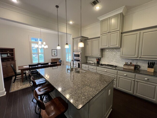 Building Photo - Luxury 4BR Home in Americana | 11 Ft Ceilings, Courtyard Living & Furnished Option
