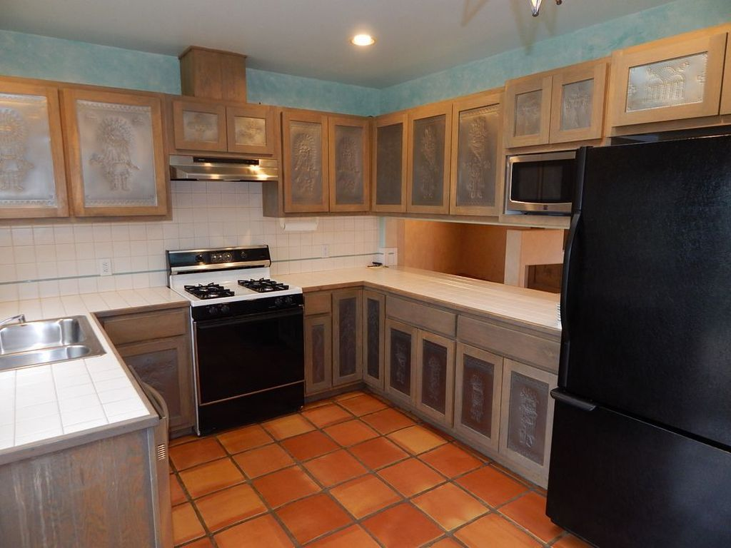 Kitchen with handmade tin inserts by artist - 1005 Calle Dorthia