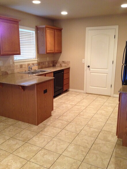 Full-sized washer & dryer next to kitchen - 3876 W Mahogany Dr