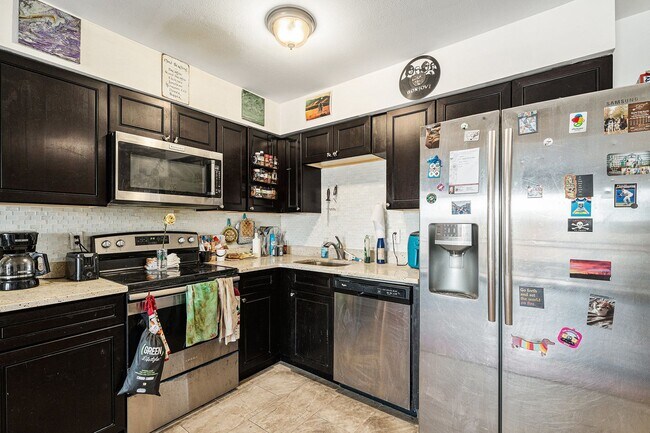 Building Photo - Top-Floor Condo with Trail Access + Community Perks!