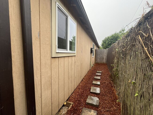 Building Photo - Inviting 2 Bedroom Home with Open Layout, Stainless Steel Appliances & Private Outdoor Retreat