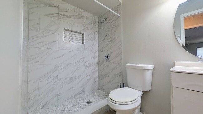 Building Photo - 2 bedroom 2 bath with an updated kitchen, bathrooms, and tile flooring throughout.